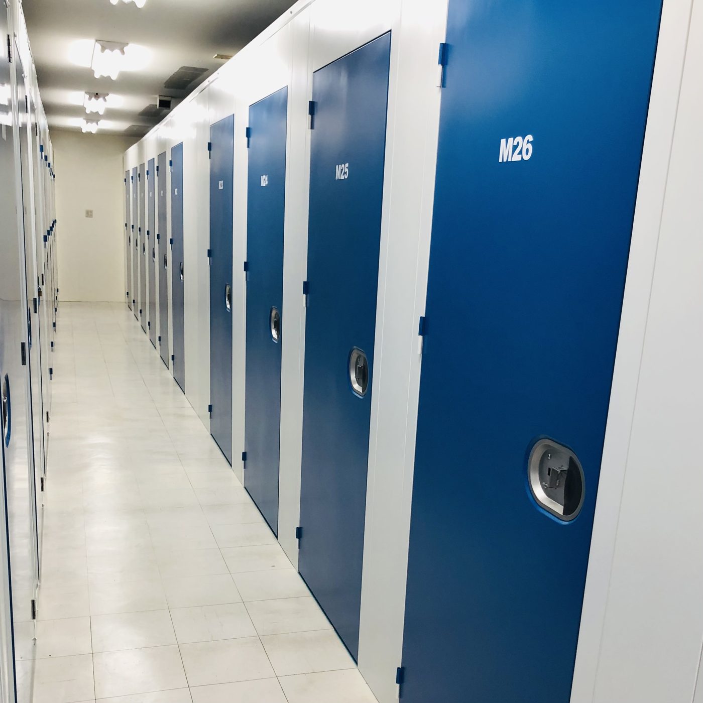 Indoor storage hallway with blue doors