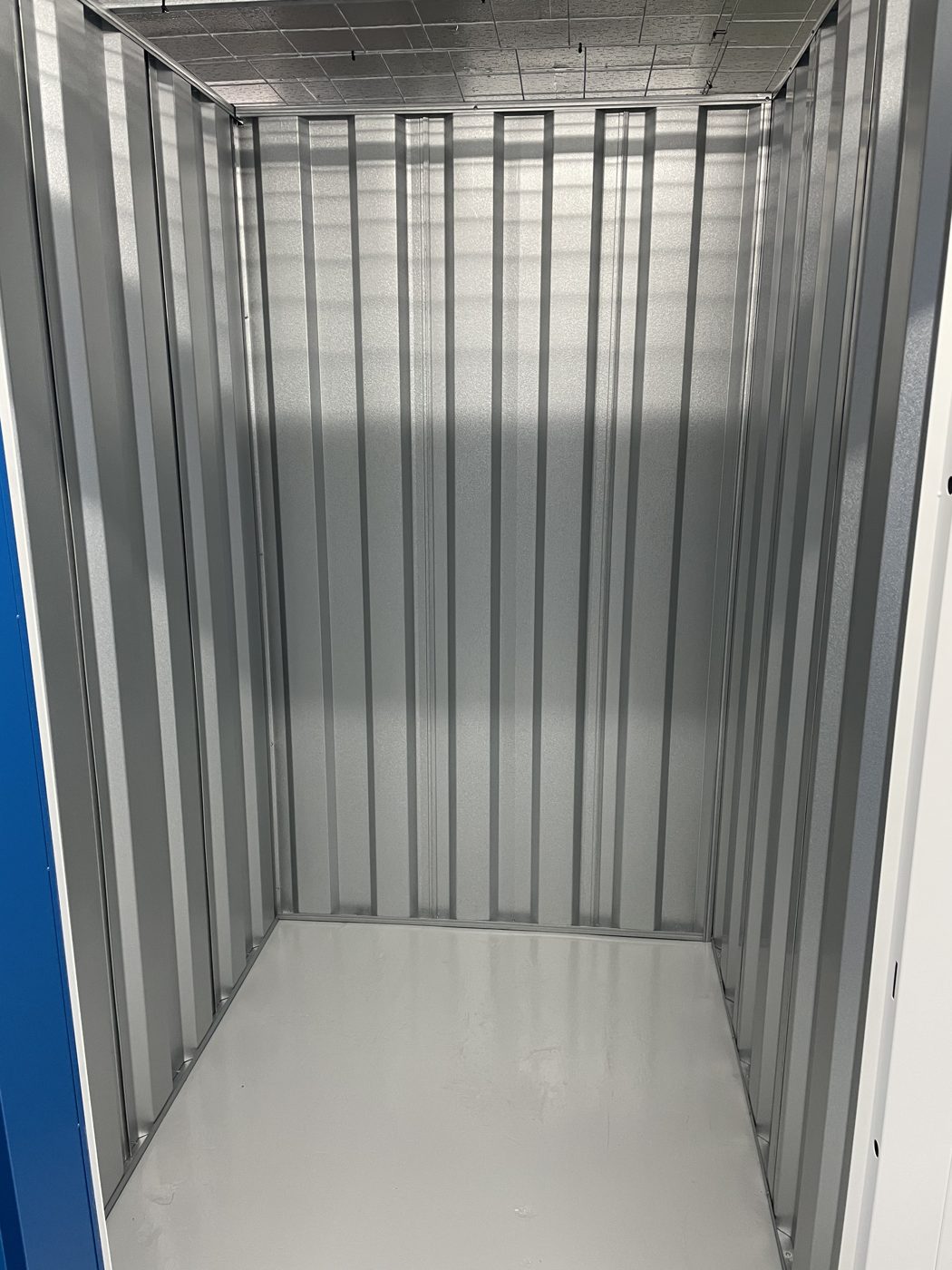 Row of secure blue storage unit doors